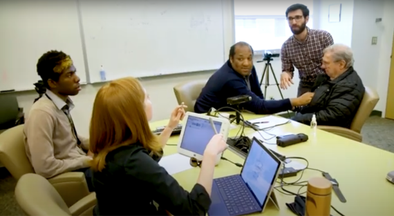 Neuroscience and neuroethics researchers engaging with a participant.