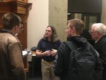 David Wallace talking with students post-lecture