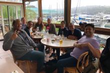 Neuroethics group sitting around table at Agua Verde restaurant