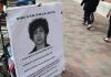 Image of sidewalk with poster of  Dzhokhar Tsarnaev titled FBI/CIA fall guy