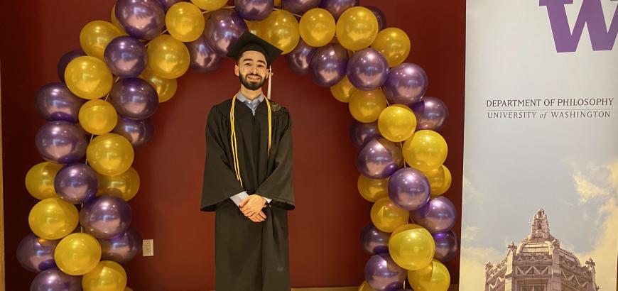 graduate with balloon arch