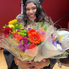 Graduate with bouquet